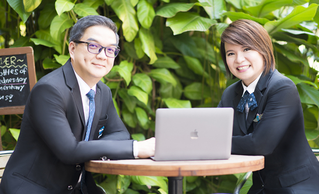 Francis and Ming Formal Relax Setting Francis and Ming of Ming Property posing with formal Propnex attire in cafe